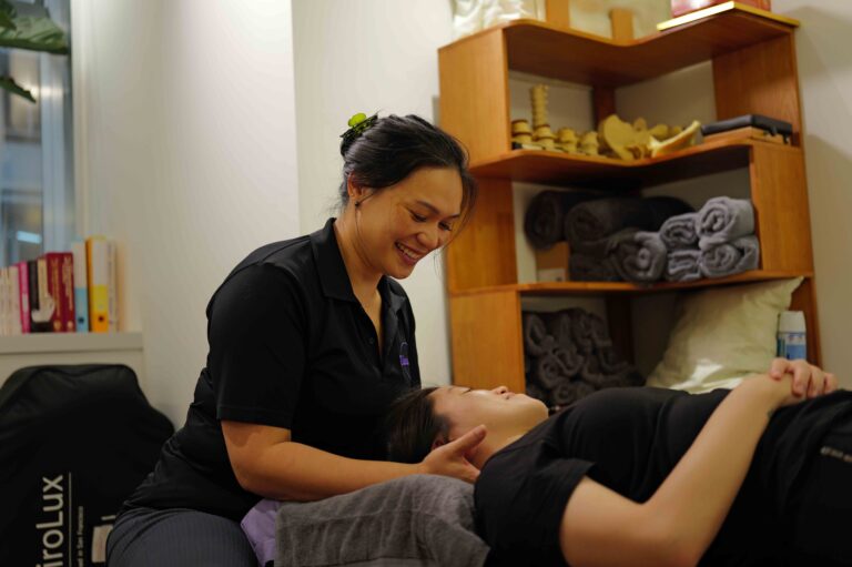 Dr Elaine Leung, chiropractor in Hong Kong, treating a patient at Total Health