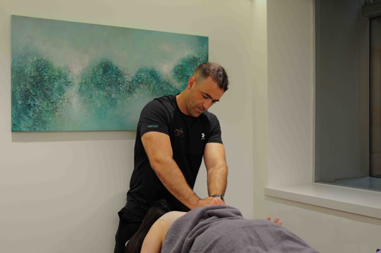 Trainer demonstrating a mobility exercise