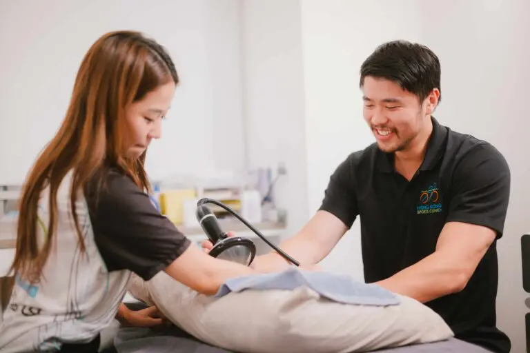 Clinician taking a patient's blood pressure during an assessment