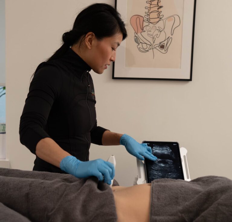 Clinician performing a diagnostic ultrasound scan